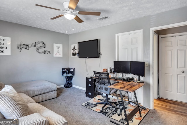 5545 Circlestone Ln, Stone Mountain, GA 30083 - carpeted home office featuring baseboards, a ceiling fan, visible vents, and a textured ceiling