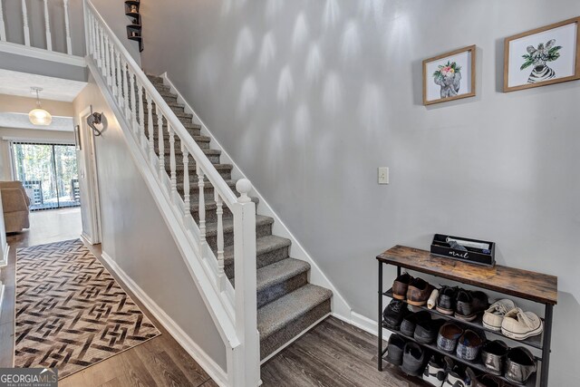 5545 Circlestone Ln, Stone Mountain, GA 30083 - stairway featuring baseboards and wood finished floors