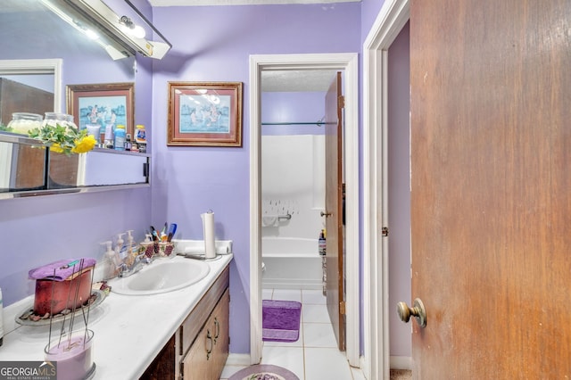 full bathroom featuring tile patterned flooring and vanity