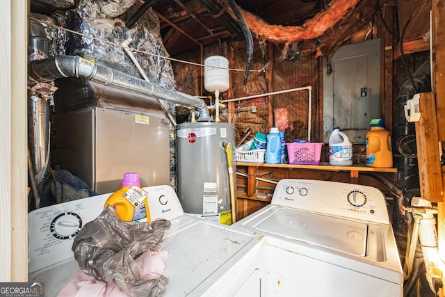 laundry room with gas water heater, electric panel, independent washer and dryer, and laundry area