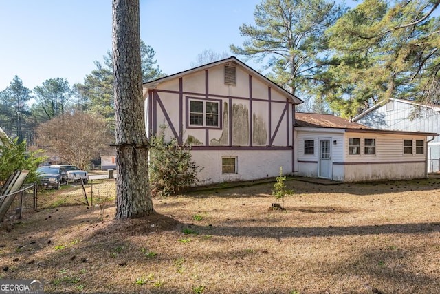 rear view of house with fence