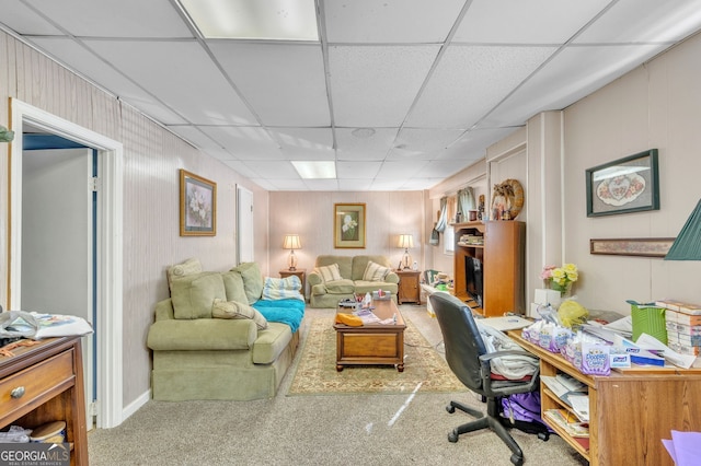 carpeted office with a drop ceiling