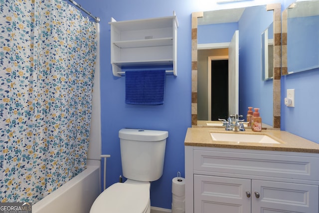 bathroom featuring toilet, shower / tub combo with curtain, and vanity