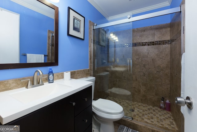 full bath with vanity, a shower stall, toilet, and ornamental molding