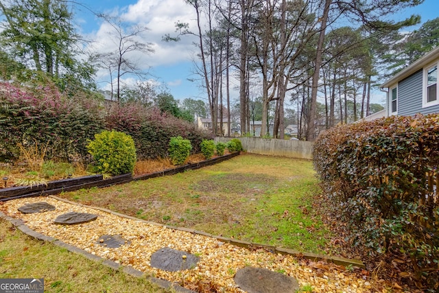 view of yard featuring fence