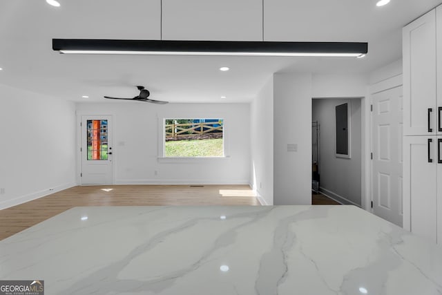 926 Natham Dr SE, Atlanta, GA 30315 - interior space with electric panel, baseboards, recessed lighting, a ceiling fan, and light wood-style floors