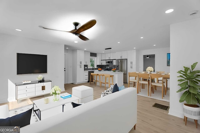 926 Natham Dr SE, Atlanta, GA 30315 - living area featuring light wood-style floors, ceiling fan, and recessed lighting