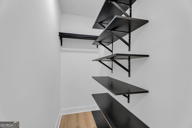 926 Natham Dr SE, Atlanta, GA 30315 - walk in closet featuring wood finished floors