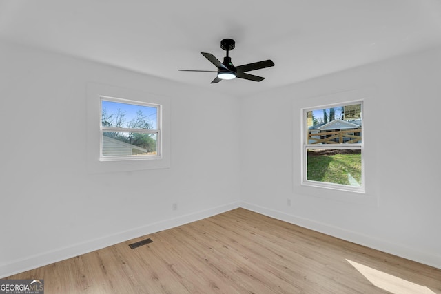 926 Natham Dr SE, Atlanta, GA 30315 - spare room featuring baseboards, light wood-style flooring, visible vents, and a ceiling fan
