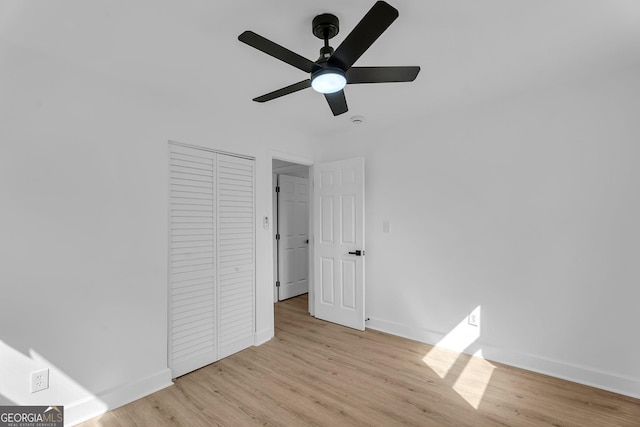 926 Natham Dr SE, Atlanta, GA 30315 - unfurnished bedroom featuring a ceiling fan, a closet, baseboards, and light wood-style floors