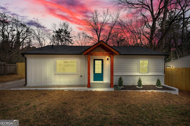 926 Natham Dr SE, Atlanta, GA 30315 - view of front facade with brick siding, fence, and a lawn