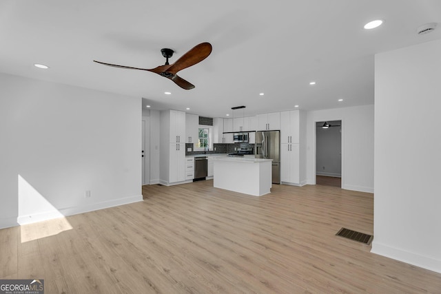 926 Natham Dr SE, Atlanta, GA 30315 - unfurnished living room with visible vents, recessed lighting, light wood-type flooring, and a ceiling fan