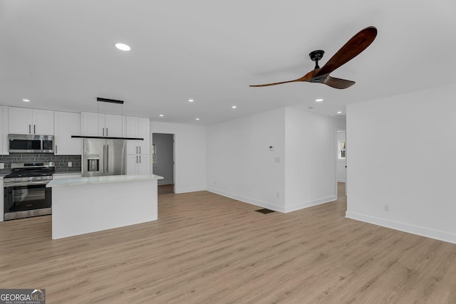 926 Natham Dr SE, Atlanta, GA 30315 - kitchen featuring decorative backsplash, light wood-style flooring, recessed lighting, a ceiling fan, and appliances with stainless steel finishes