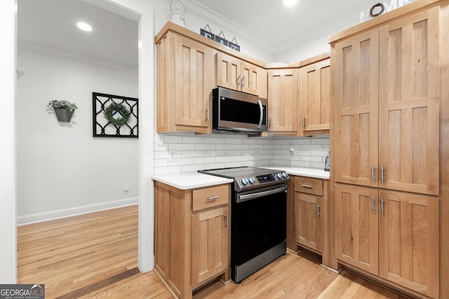 kitchen with light brown cabinetry, decorative backsplash, stainless steel appliances, and ornamental molding