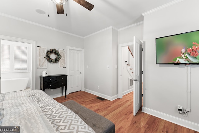 bedroom with crown molding, light wood-style floors, baseboards, and ceiling fan