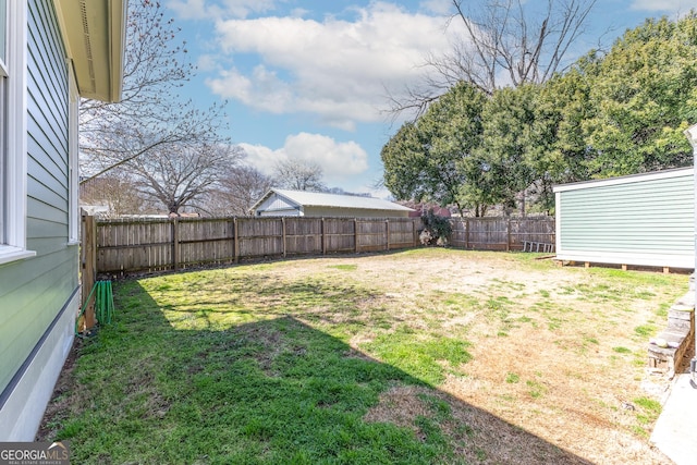 view of yard featuring a fenced backyard