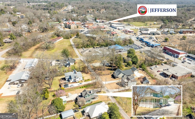 birds eye view of property with a residential view