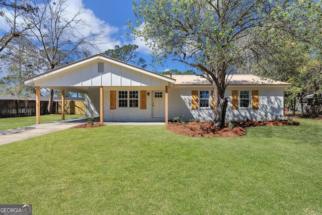 single story home featuring brick siding and driveway