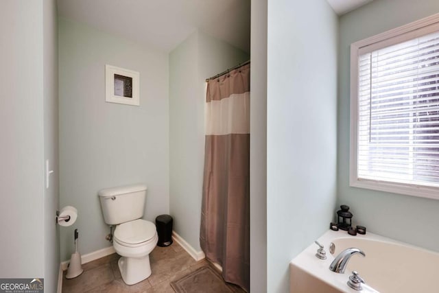 full bathroom with tile patterned floors, toilet, a shower with shower curtain, baseboards, and a bath