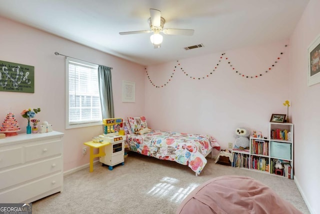 bedroom with baseboards, visible vents, a ceiling fan, and carpet