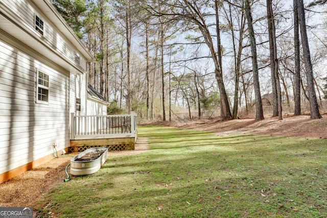 view of yard with a deck