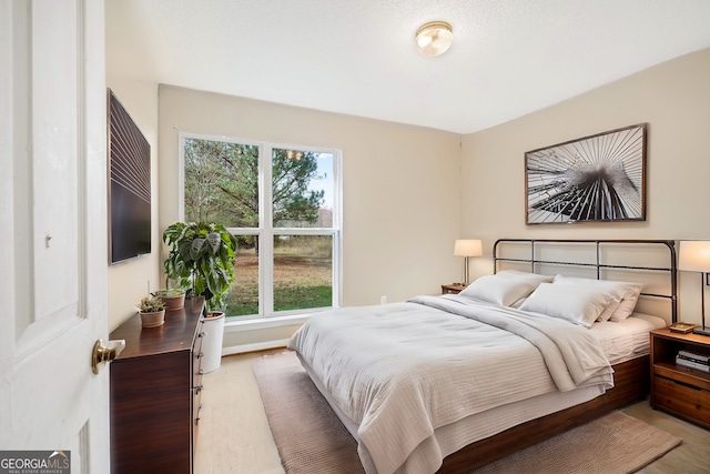 bedroom featuring baseboards