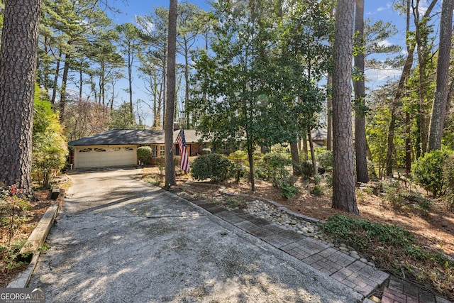 view of front facade featuring concrete driveway and an attached garage