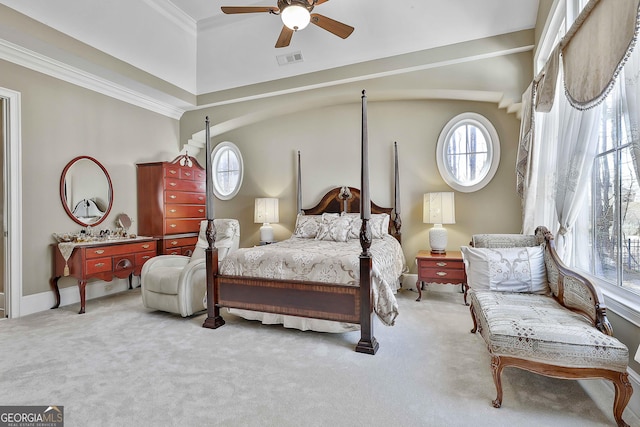 bedroom featuring visible vents, carpet floors, ornamental molding, and a ceiling fan