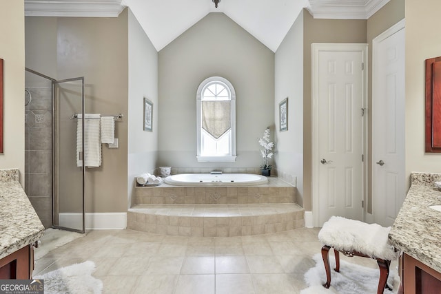 bathroom featuring tile patterned flooring, a shower stall, lofted ceiling, a garden tub, and vanity