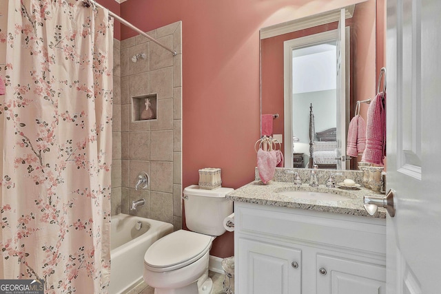 bathroom featuring shower / tub combo with curtain, vanity, and toilet