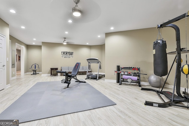 exercise area with wood finished floors, recessed lighting, a ceiling fan, and baseboards