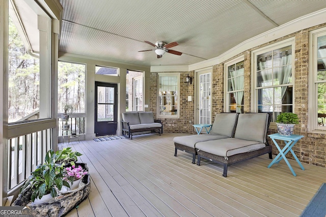 sunroom with a ceiling fan