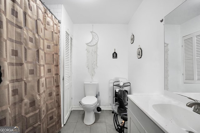 full bath with tile patterned flooring, toilet, vanity, and baseboards