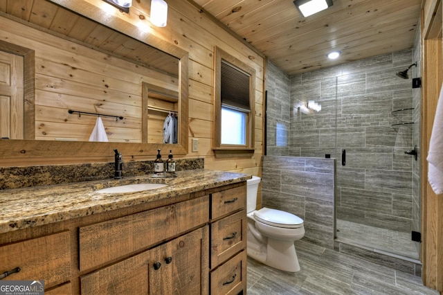 full bathroom featuring vanity, toilet, wood ceiling, and a stall shower