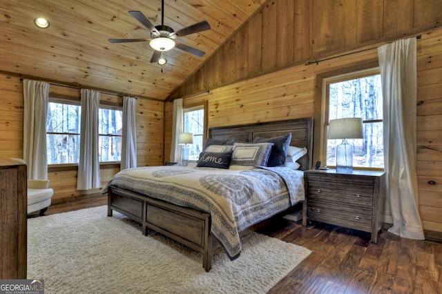 bedroom with dark wood-style floors, high vaulted ceiling, wood ceiling, and wood walls