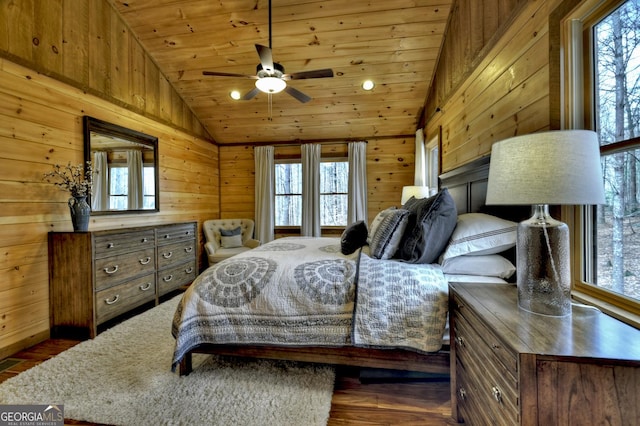 bedroom with wood walls, wooden ceiling, and vaulted ceiling