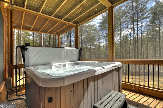 wooden terrace with a hot tub