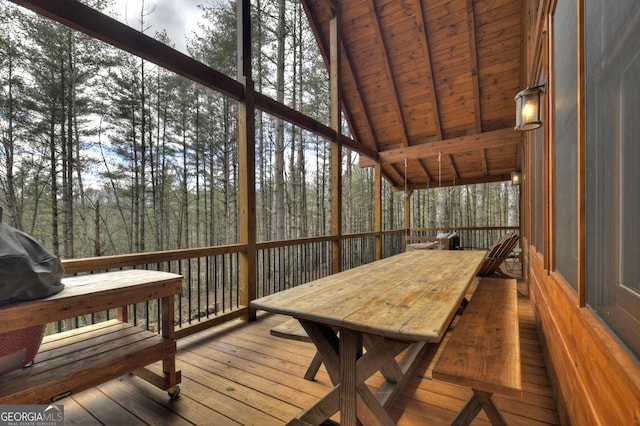 deck with outdoor dining area