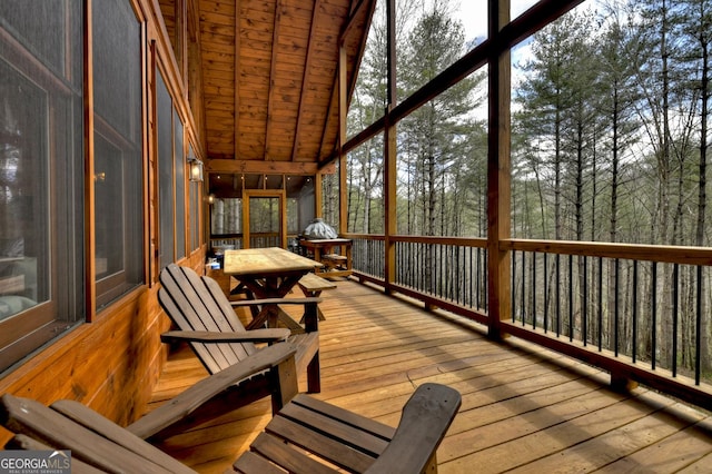 sunroom / solarium with vaulted ceiling and wood ceiling