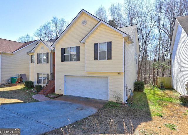 view of front of home featuring an attached garage and driveway