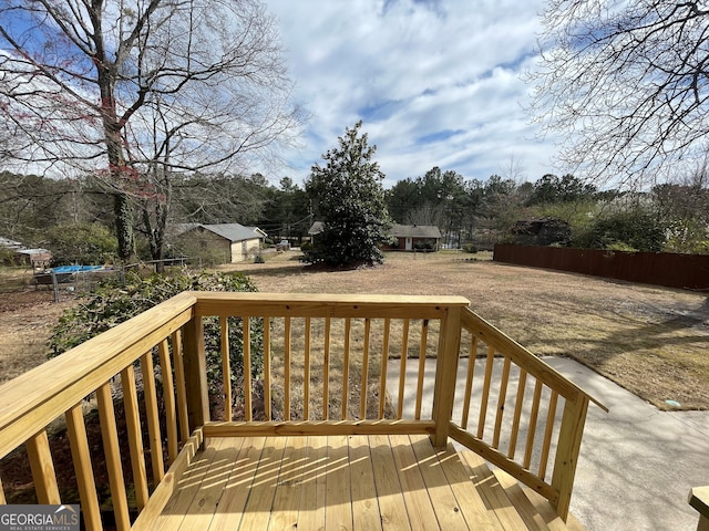 wooden deck with an outbuilding