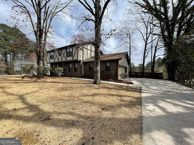 view of front of house with brick siding, concrete driveway, and an attached garage