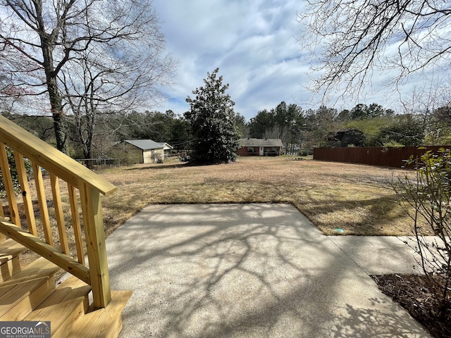 view of yard featuring a patio area and fence