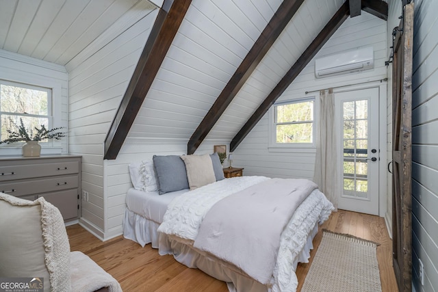 bedroom featuring lofted ceiling with beams, light wood-type flooring, wooden walls, and an AC wall unit