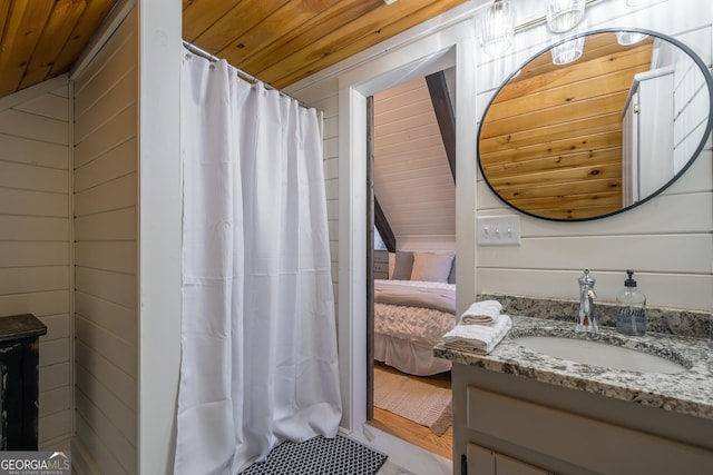 bathroom with vanity, a shower with shower curtain, wood ceiling, and wood walls