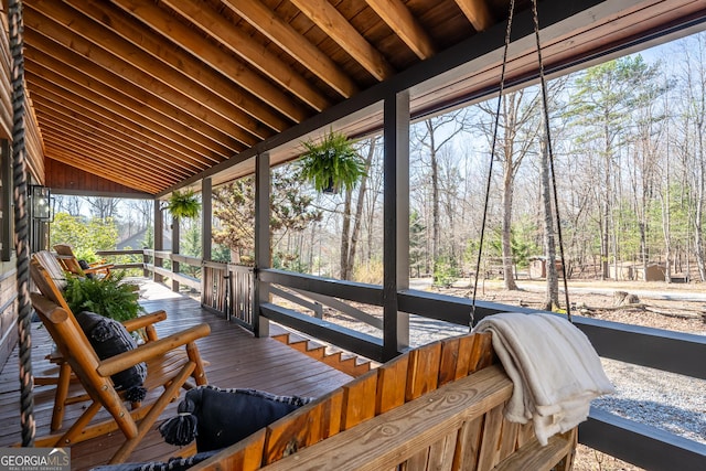 wooden terrace with a porch