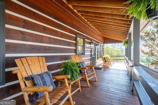 wooden deck featuring covered porch