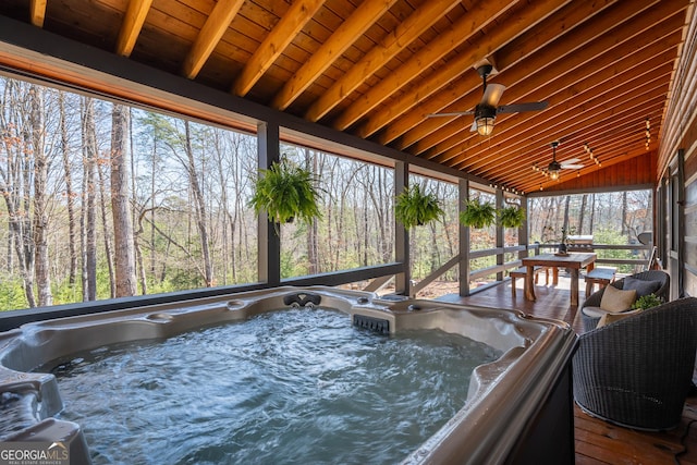 unfurnished sunroom featuring a jacuzzi, wood ceiling, and lofted ceiling with beams