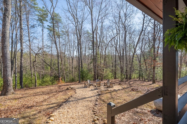 view of yard featuring a wooded view