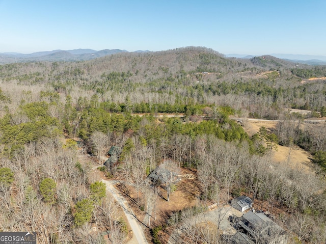 aerial view with a mountain view and a view of trees